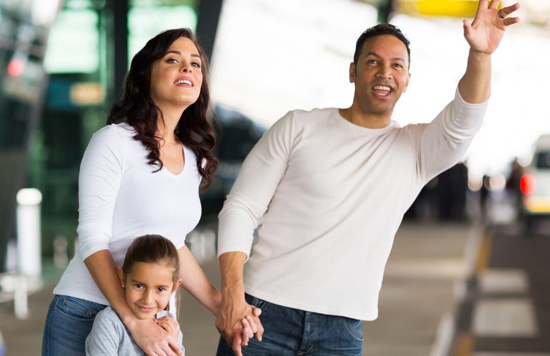 Family boarding a taxi to Glasgow Airport for an airport transfer