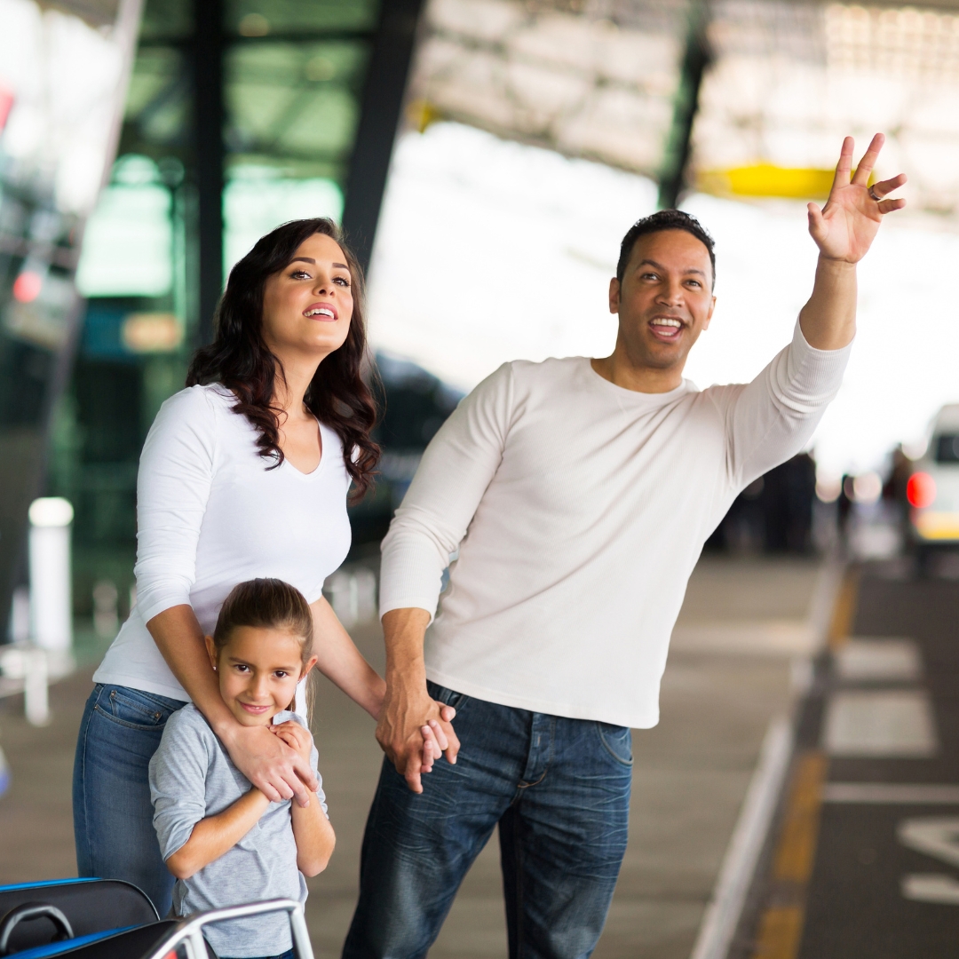 Family boarding a taxi to Glasgow Airport for an airport transfer